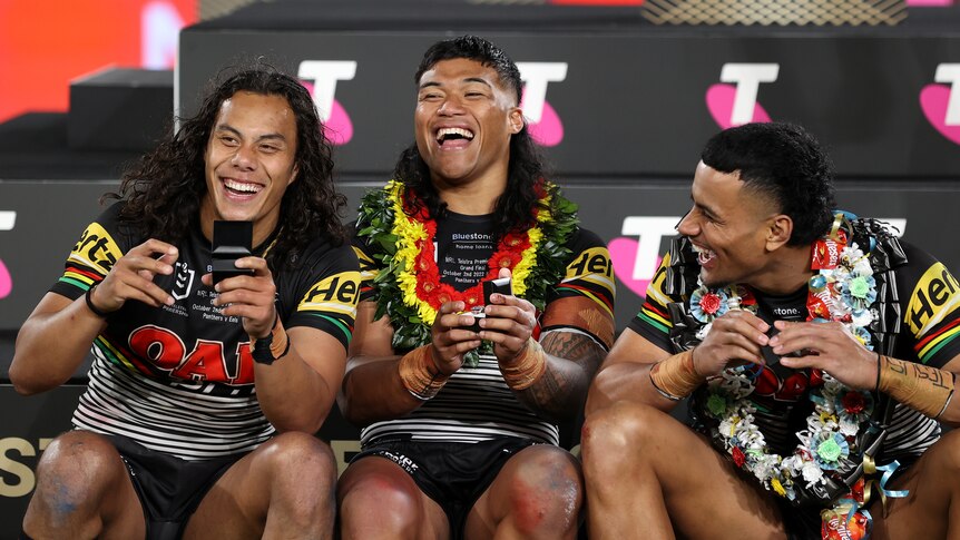 Penrith Panthers' Jarome Luai, Brian To'o and Stephen Crichton laugh after winning the NRL grand final.