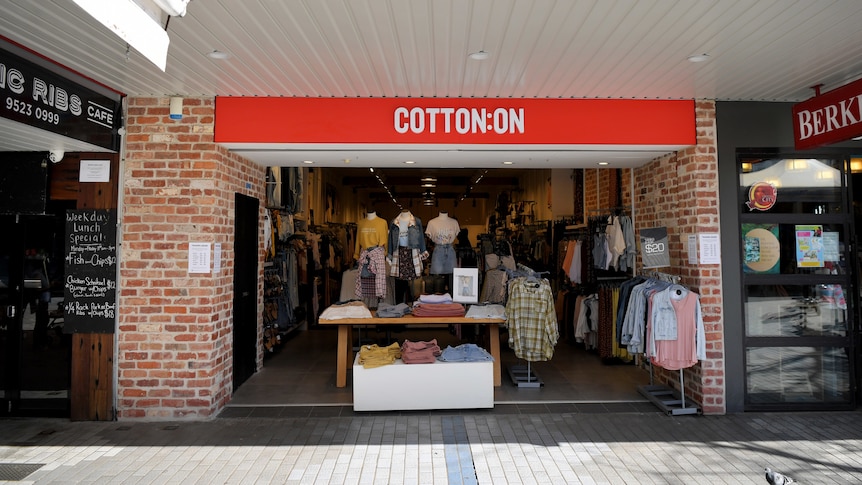 A Cotton On street store showcases shirts on mannequins