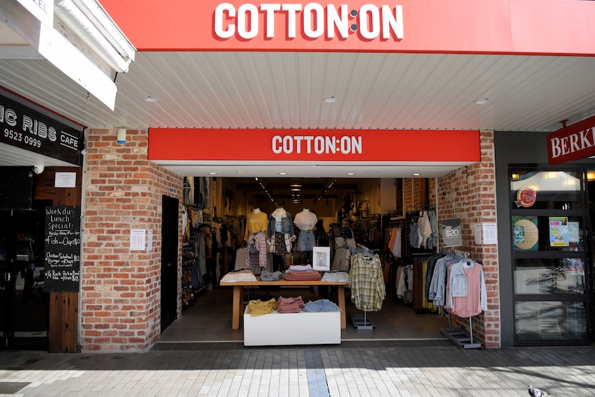 A Cotton On street store showcases shirts on mannequins