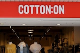 A Cotton On street store showcases shirts on mannequins