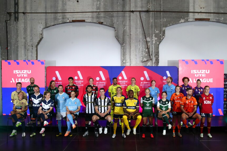 Players from each A-Leagues club at a launch event for the new season. They are arranged in two rows, all in their jerseys.
