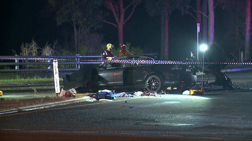 A black car crashed at night time