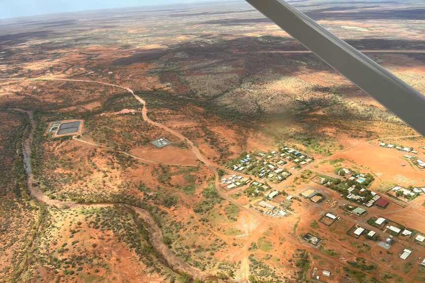 An outback town and the surrounding countryside shown from above in Western Australia's Pilbara region