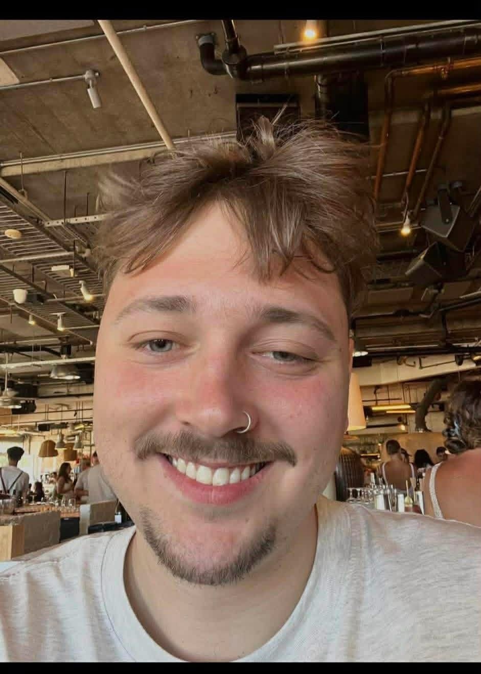 Mother honours 'beautiful boy' at rail station vigil attended by thousands