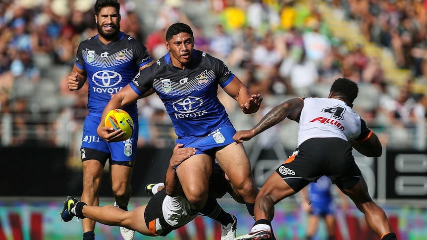 Jason Taumalolo fends off Tigers defence at Auckland Nines