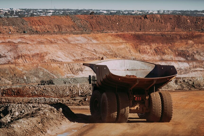A mining truck inside an open cut mine. 