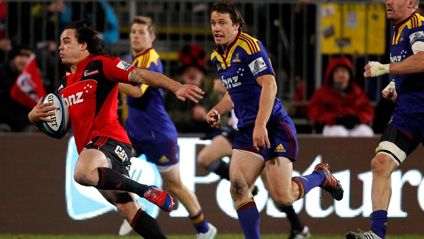 On song ... Crusaders winger Zac Guilford breaks away to score a try