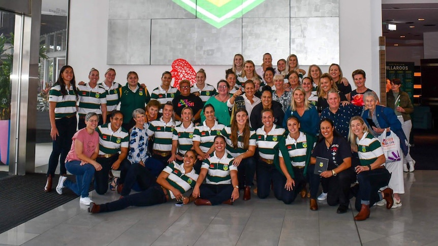 Past and present Jillaroos pose for a photo before the Rugby League World Cup in 2022.