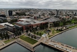 A drone photo of Geelong CBD, a regional city with a handful of high-rise buildings by the water.
