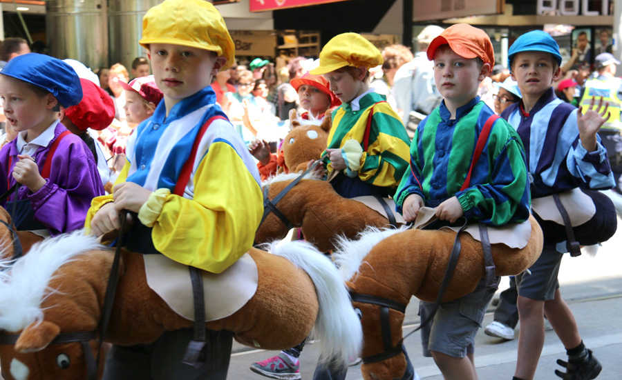 Children make way through Melbourne Cup parade