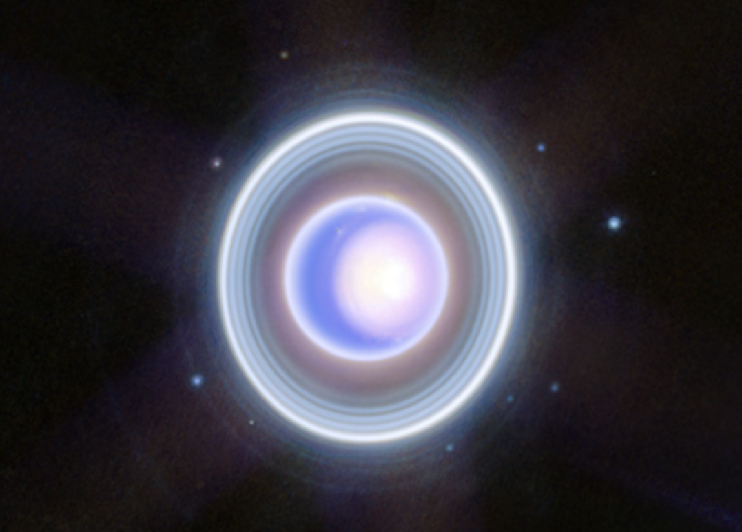 Blue coloured orb surrounded by blue and white rings.