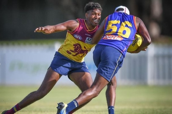 Keidean Coleman tackling his brother Blake at a Brisbane Lions training session