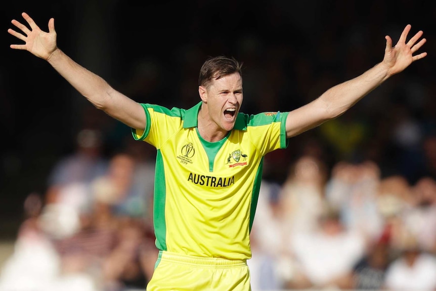 Australia's Jason Behrendorff has his mouth wide open in celebration during a Cricket World Cup clash with New Zealand.