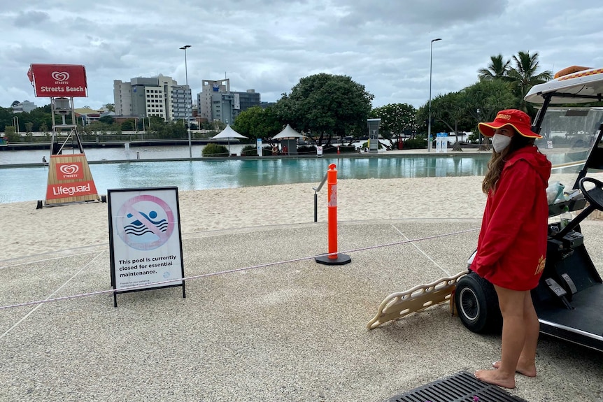A lifeguard stands next to the beach at Southbank.