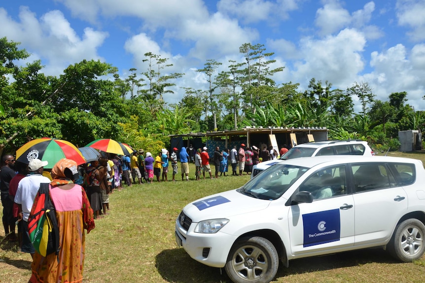 Voters queue at a polling station in Vanuatu