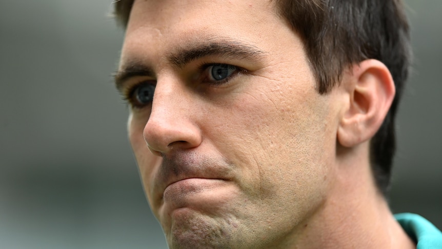 a close up of Pat Cummins's face as he speaks to media at the MCG on Christmas Day
