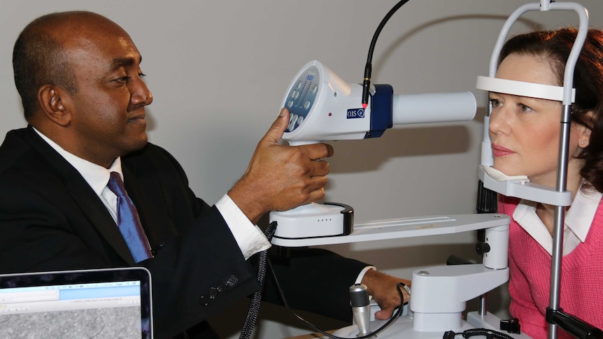 Dr Yogesan Kanagasingam performs an alzheimers eye test