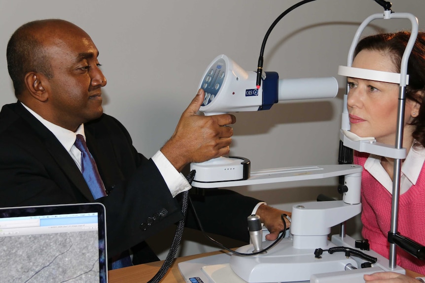 Dr Yogesan Kanagasingam performs an alzheimers eye test