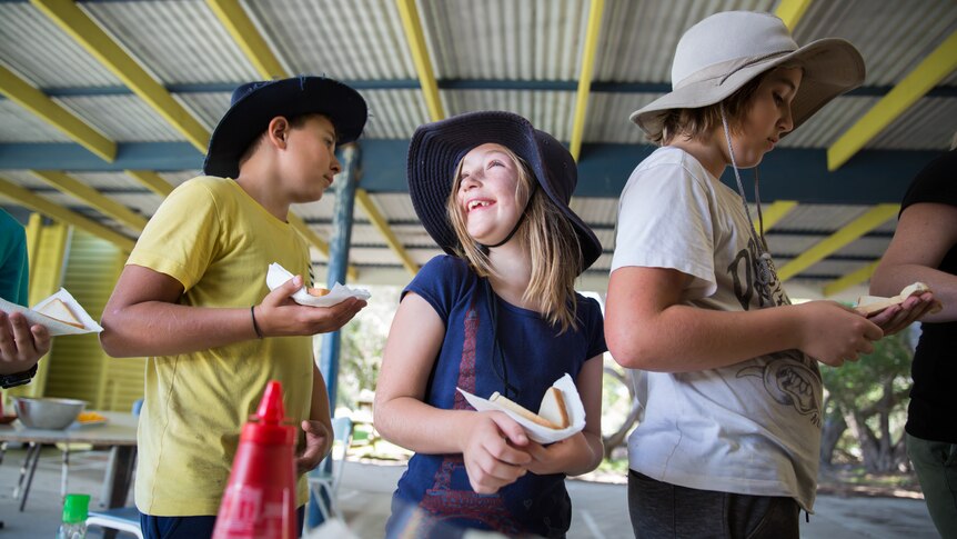 Maddy Trezise, 7, waits in the lunch line at Perseverance Primary School on French Island.