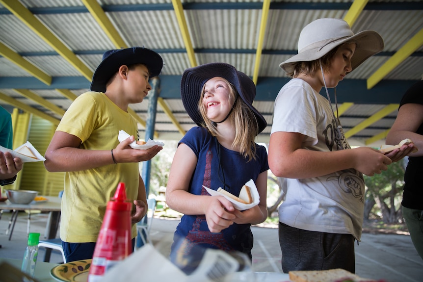 Student Maddy Trezise, 7, waits in the lunch line at Perseverance Primary School on French Island on October 19, 2018.