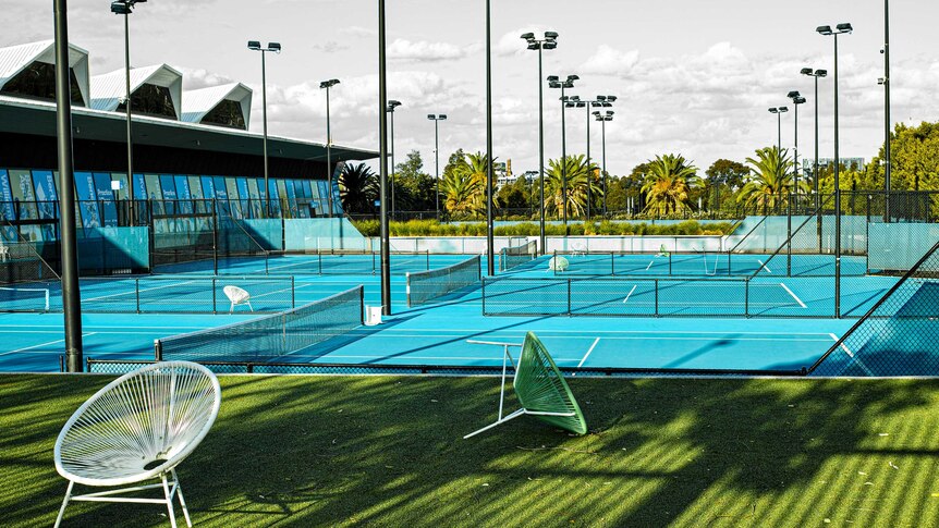 A photo of empty tennis courts at Melbourne Park.