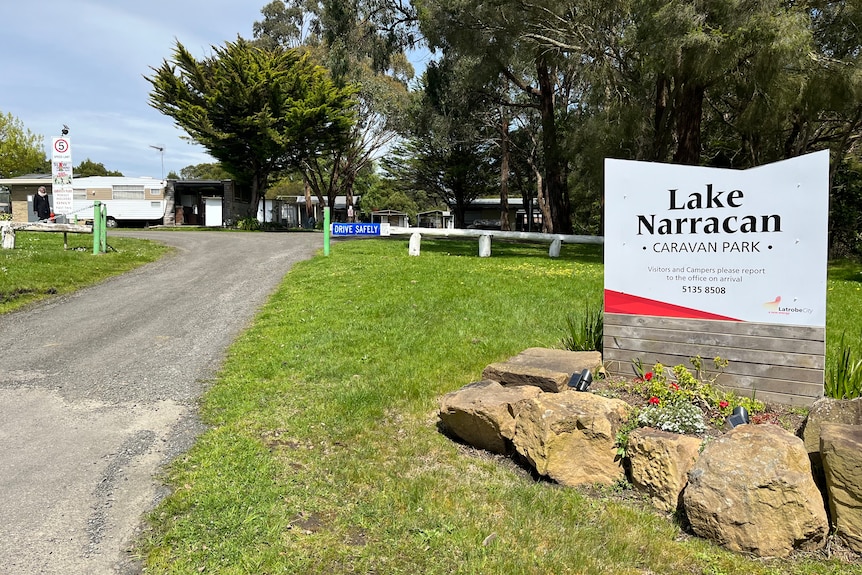 The caravan park is in the background with a Lake Narracan caravan park sign in the foreground on the right