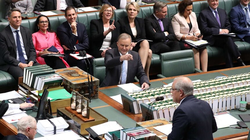 Anthony Albanese points at Scott Morrison in Parliament