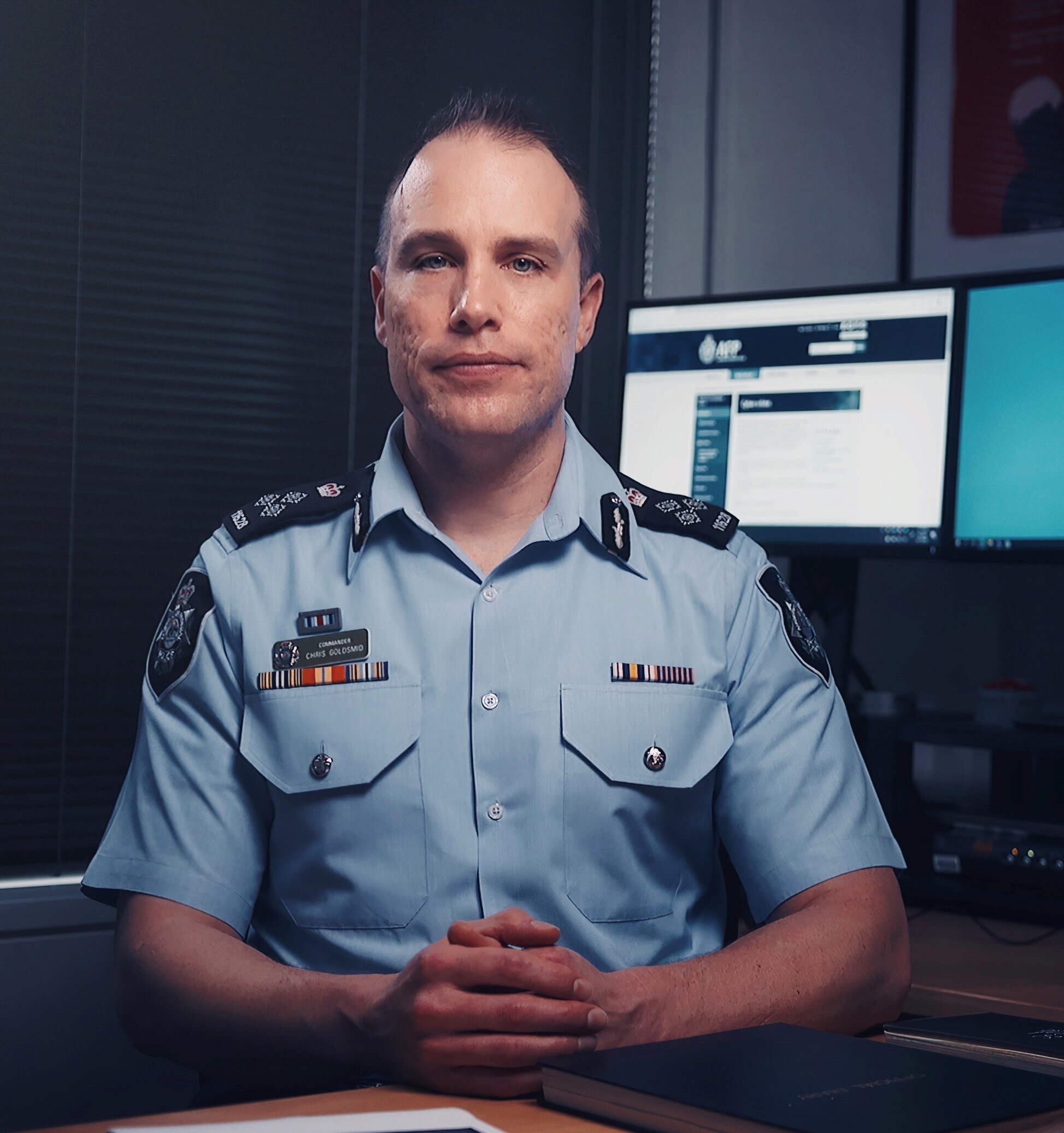 A policeman in a dark room