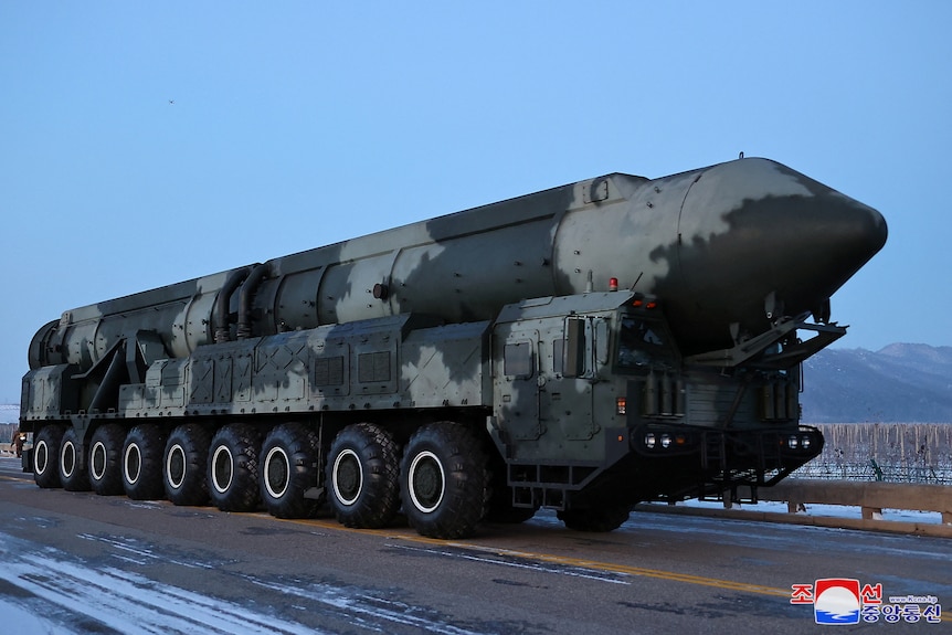 A large missile on wheels. 