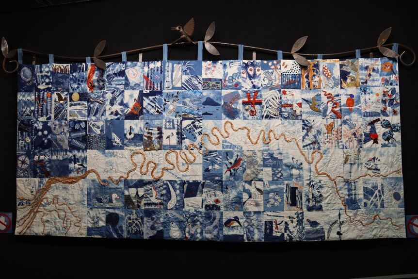 A quilt with 90 squares depicting the Adelaide River.