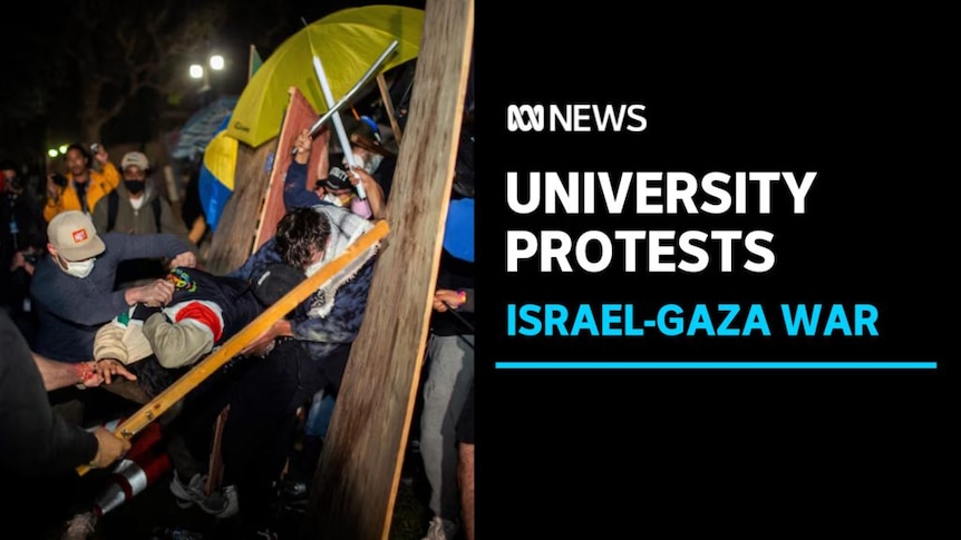 University Protests, Israel-Gaza War: A rival protester pulls someone by the back of a jumper across a wooden barricade.