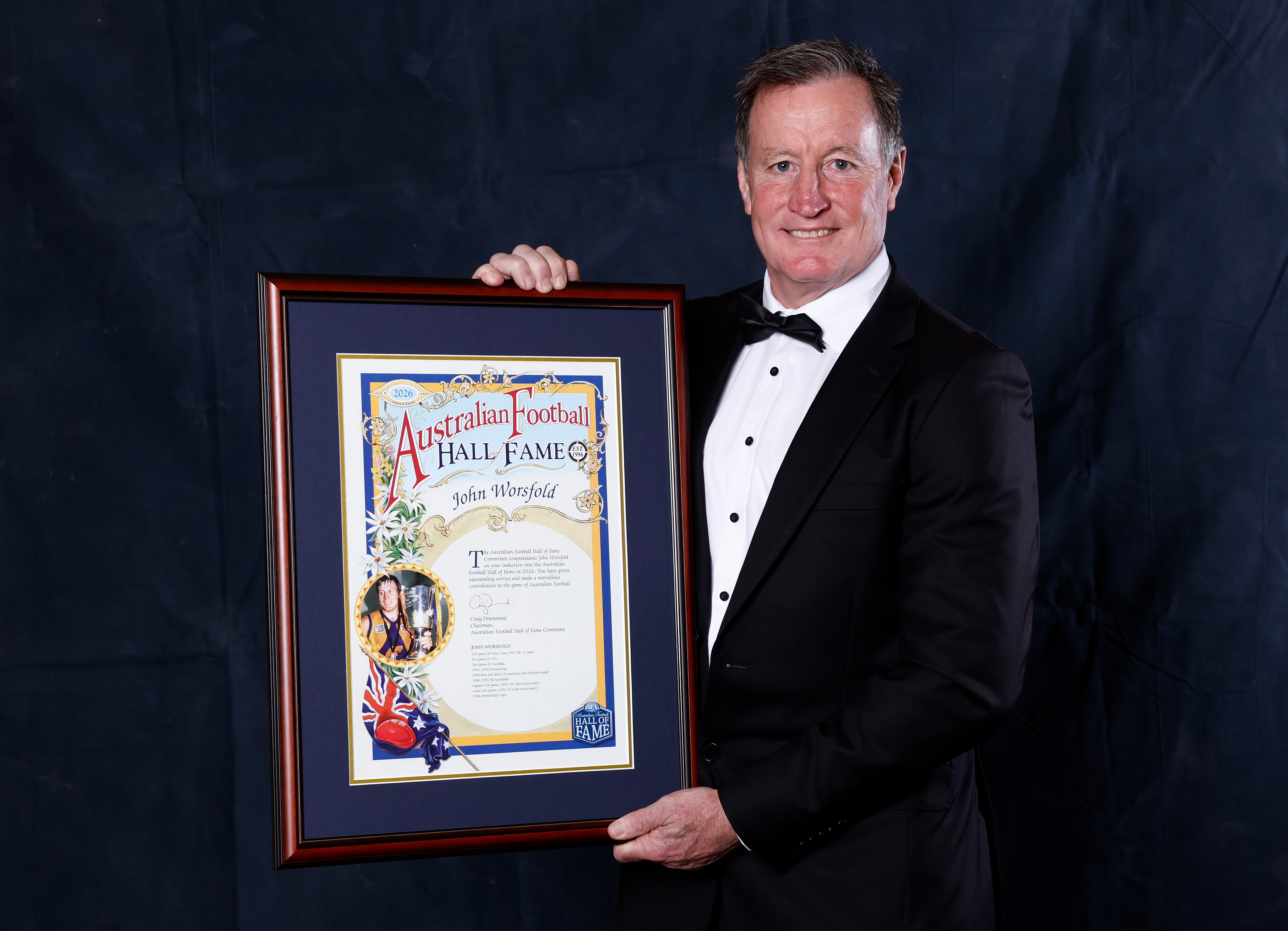 John Worsfold poses with his Australian Football Hall of Fame inductee certificate.