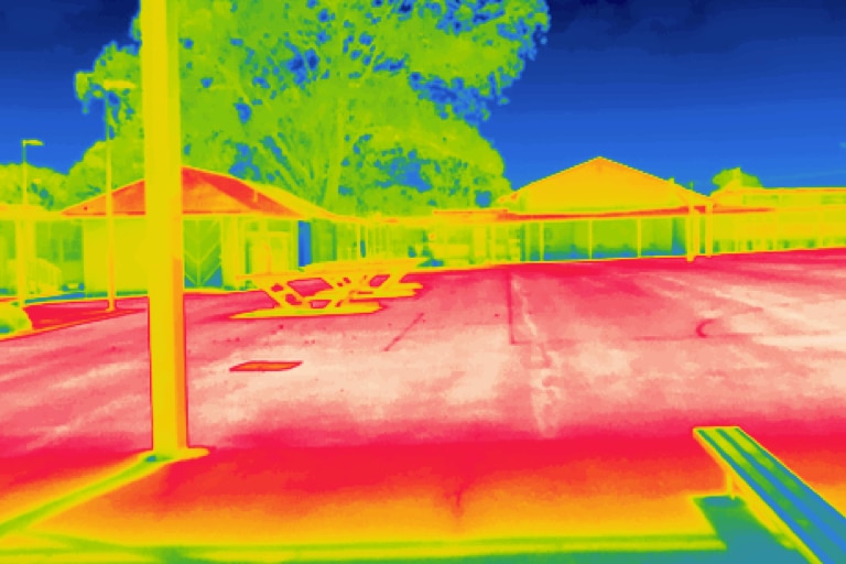 black asphalt, artificial grass and shaded areas, showing huge disparities between hot and cool zones in playgrounds