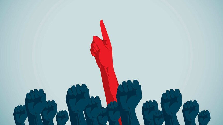 illustration of one red hand pointing amongst many grey hands with clenched fist.