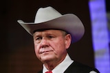 Roy Moore wears a cowboy hat. Tight headshot