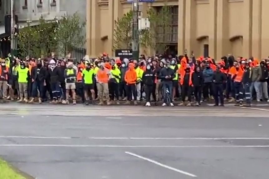 Protesters and police standoff outside Victoria CFMEU office
