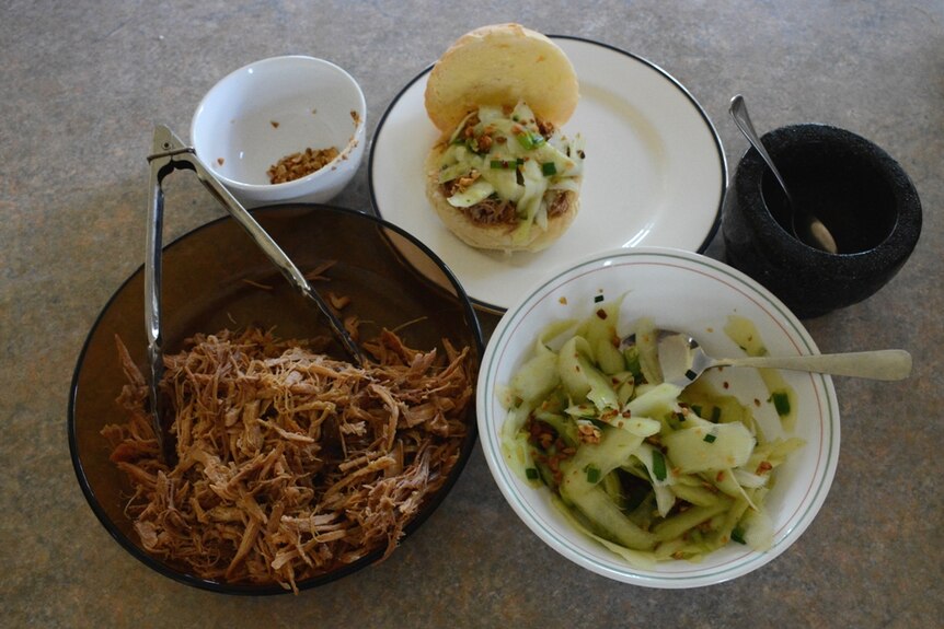 Pulled pork with pawpaw salad, served on a fresh bun. Prepared by Deb McLucas and Freckle Farm in Eton.