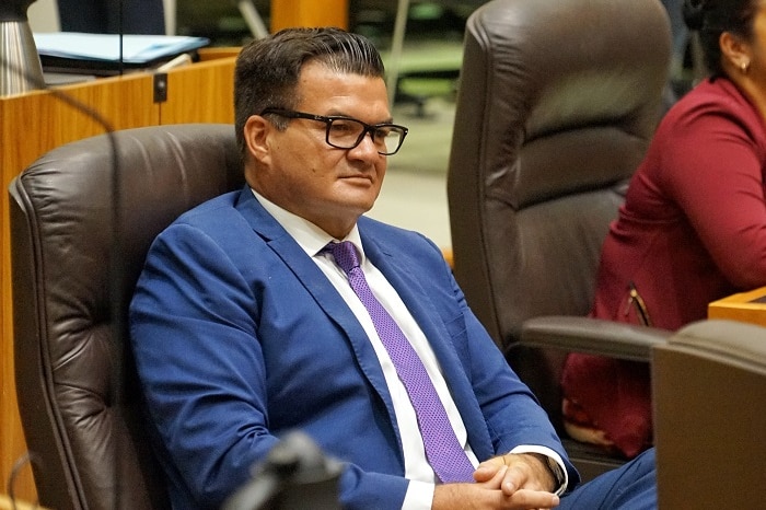 Ken Vowles sits in his seat in parliament