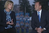 Zali Steggall and Tony Abbott facing each other