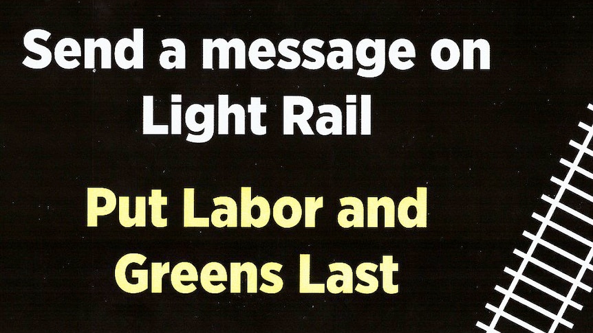 Anti-light rail advertisement that says "send a message on light rail. Put Labor and Greens last."