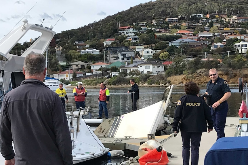 Investigators at boat fire scene.