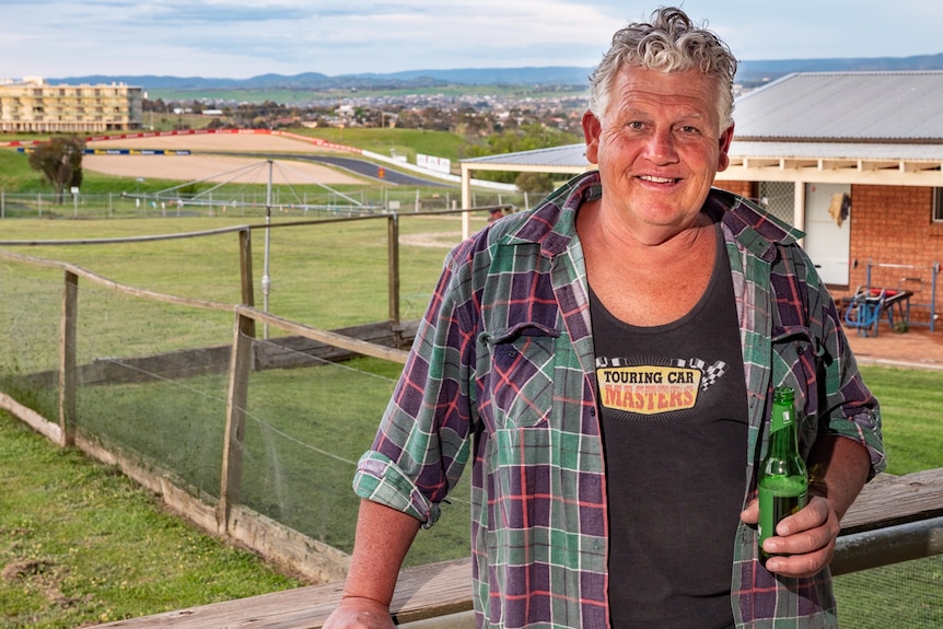 Shane Robinson at home in front of Mount Panorama motor race circuit.