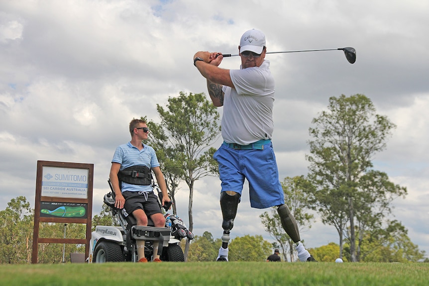 Disability golfer Mathew Forsyth and Ben Tullipan tee off at Parkwood Golf Club