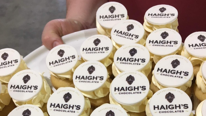 A plate full of individually wrapped Haigh's Chocolates.