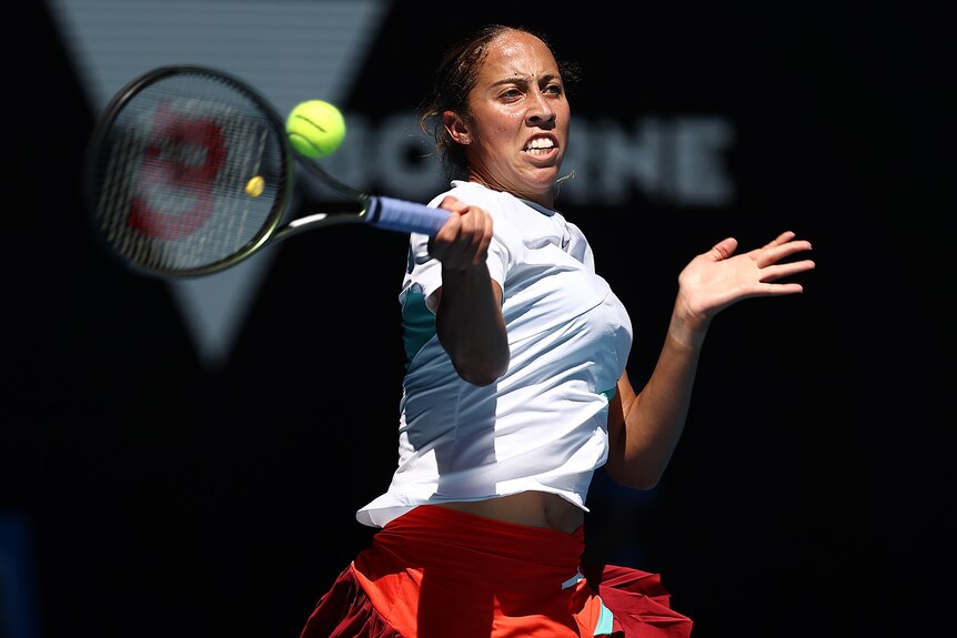 A US female tennis player hits a forehand at the Australian Open.