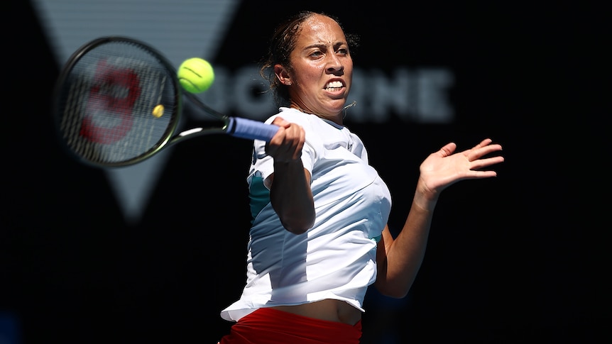 A US female tennis player hits a forehand at the Australian Open.