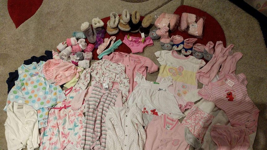 A collection of girls baby clothes
