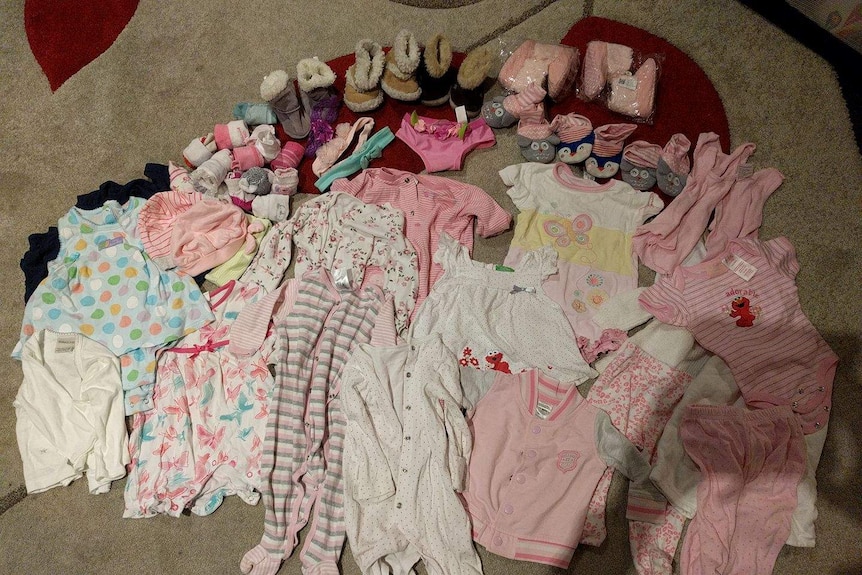 A collection of girls baby clothes