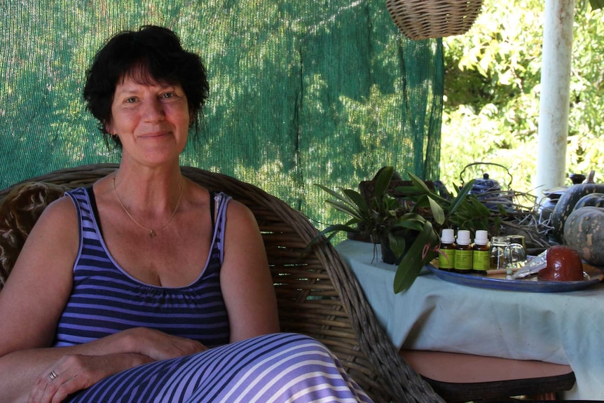 A woman sitting on a verandah