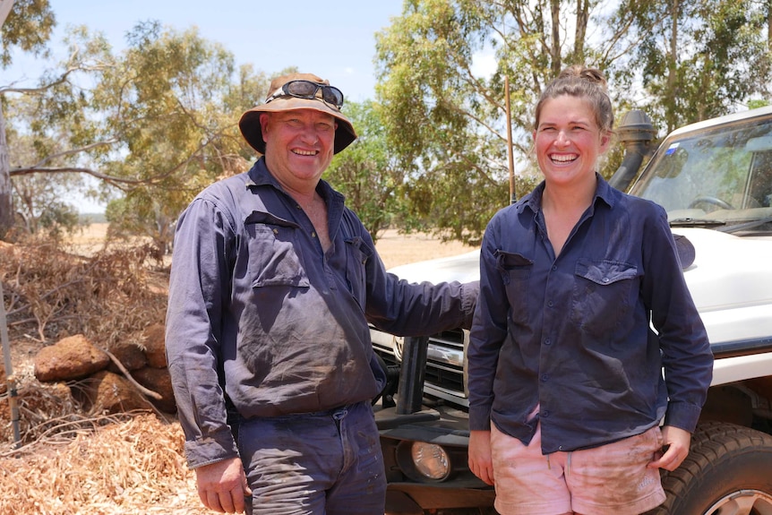 David Brown and Jemma Brown next to a white farm ute.